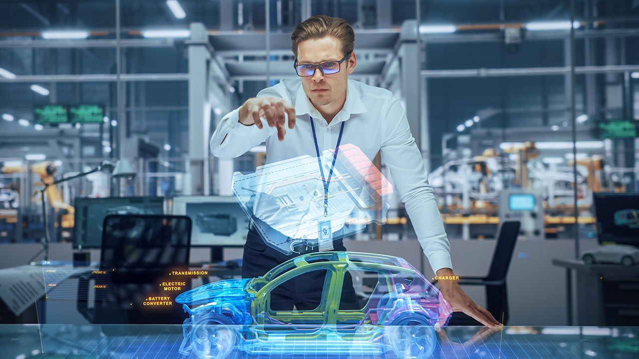 An engineer inspects a virtual model of automotive high-performance components.