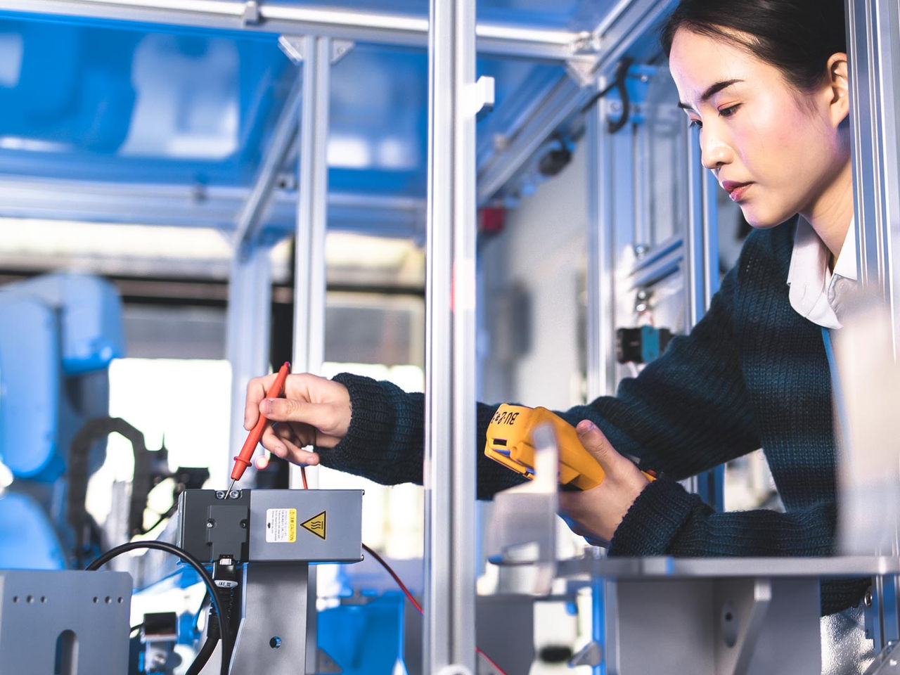 Engineer testing medical connectors in a high-tech laboratory.