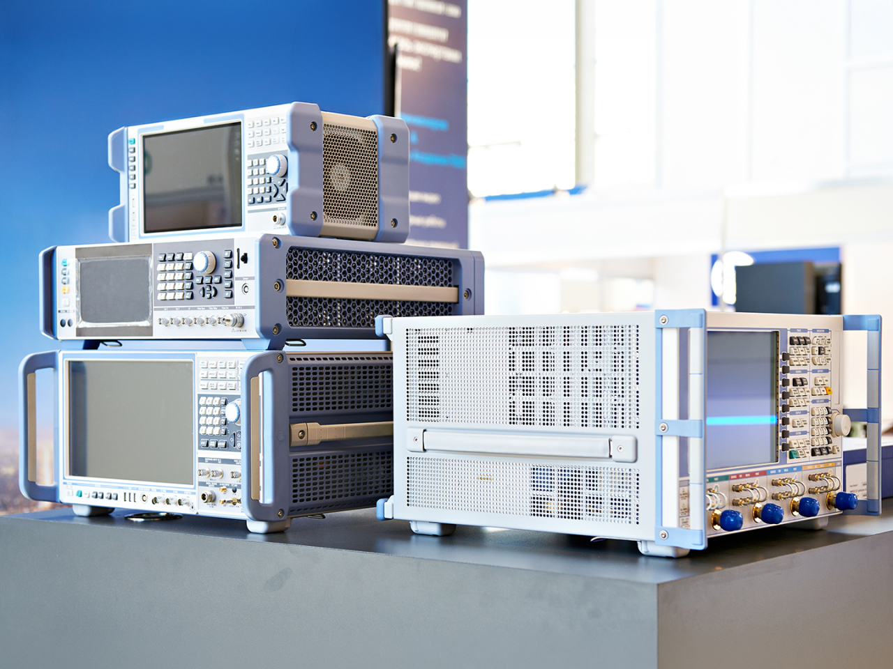 RF test and measurement instruments with multiple coaxial connector ports in an electronics laboratory. 