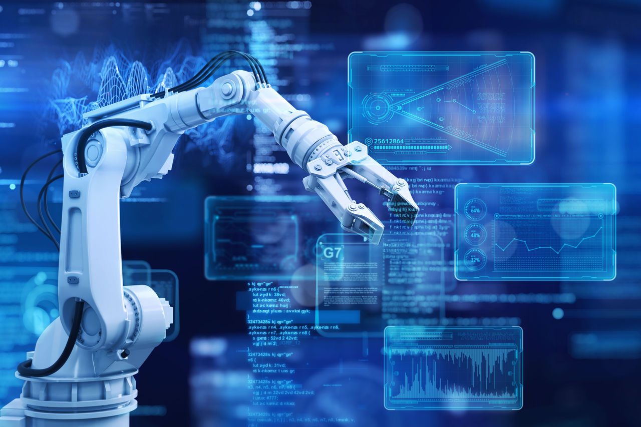 A robotic arm operates in the foreground with digital interface screens behind it, representing data analysis and automation in a smart factory setting. 