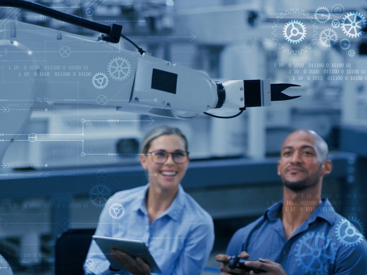 Engineers inspecting connectivity in industrial robots. 