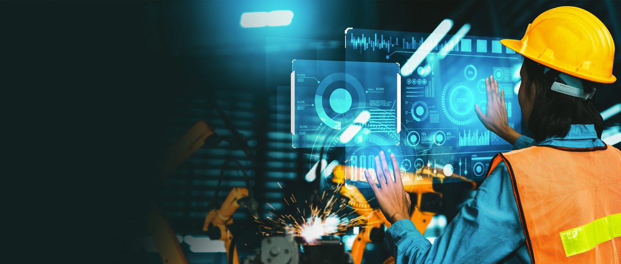 An operator uses a virtual control panel to manage an Industry 4.0 manufacturing environment.
