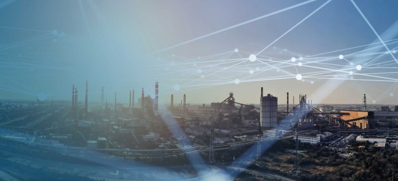 An industrial plant overlayed with connectivity illustrations.