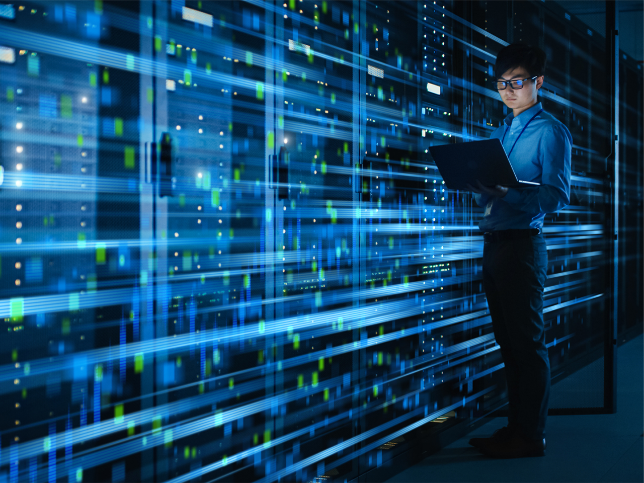 An IT specialist monitoring co-packaged optics (CPO) in a data center. 